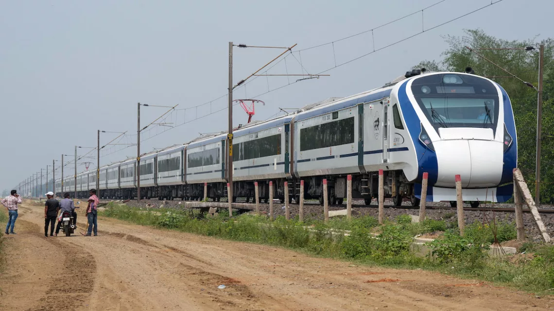 Balasore: Vande Bharat Express passes by the site where the recent triple-train accident happened, near Bahanaga Bazar railway station after train service resumes, in Balasore district, Wednesday, June 7, 2023. (PTI Photo/Swapan Mahapatra)(PTI06_07_2023_000070B)