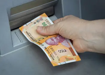 Indian rupees withdrawn from the ATM, Financial and economic concept related to inflation and rising cost of living, Declining value of money