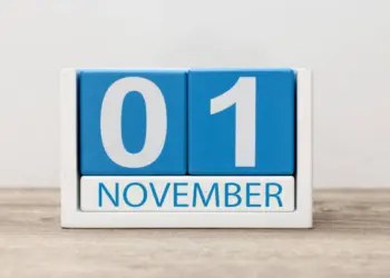 November 1st. Day 1 of month, wooden color calendar on light background. Autumn time.